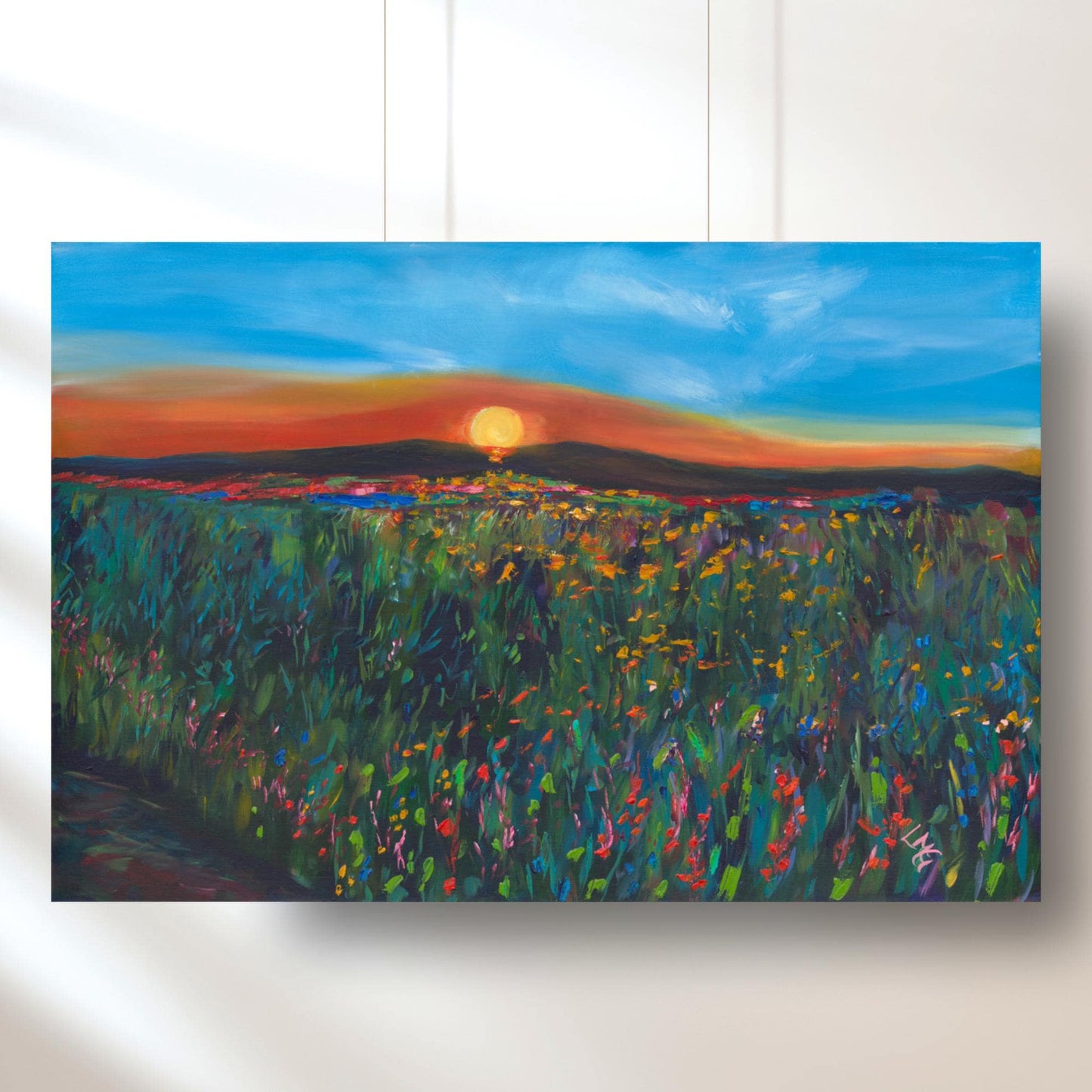 Idaho sunset wildflower print with glowing sun over rolling hills, perfect for adding natural beauty to a peaceful living room.