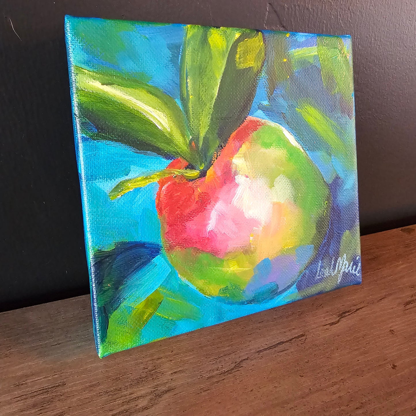 Close-up of vibrant apple artwork with fresh spring leaves and luminous color, part of Leah’s 2026 Spring Minis collection.