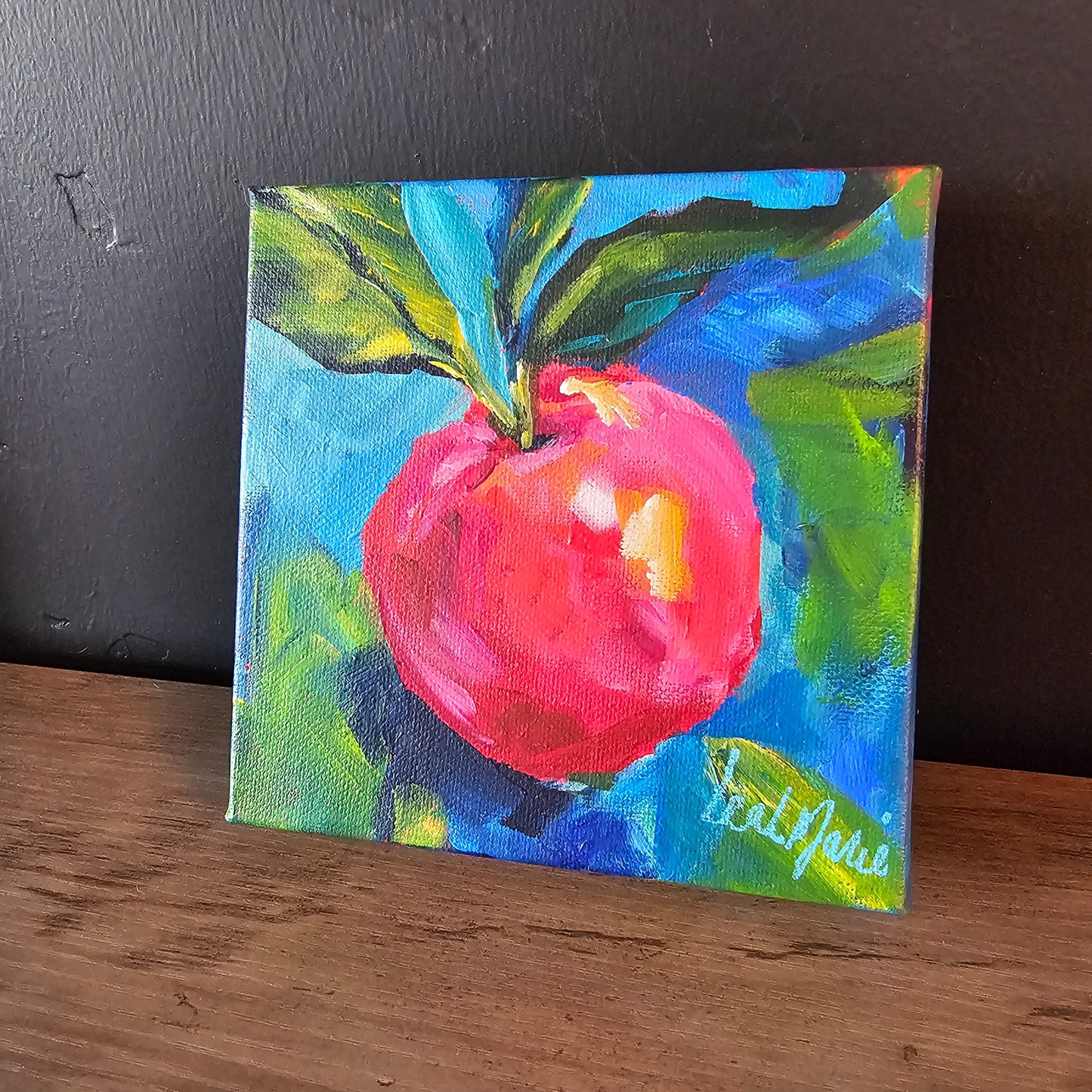 Small original still-life apple painting showcasing bold greens, bright reds, and dynamic composition for modern home decor.
