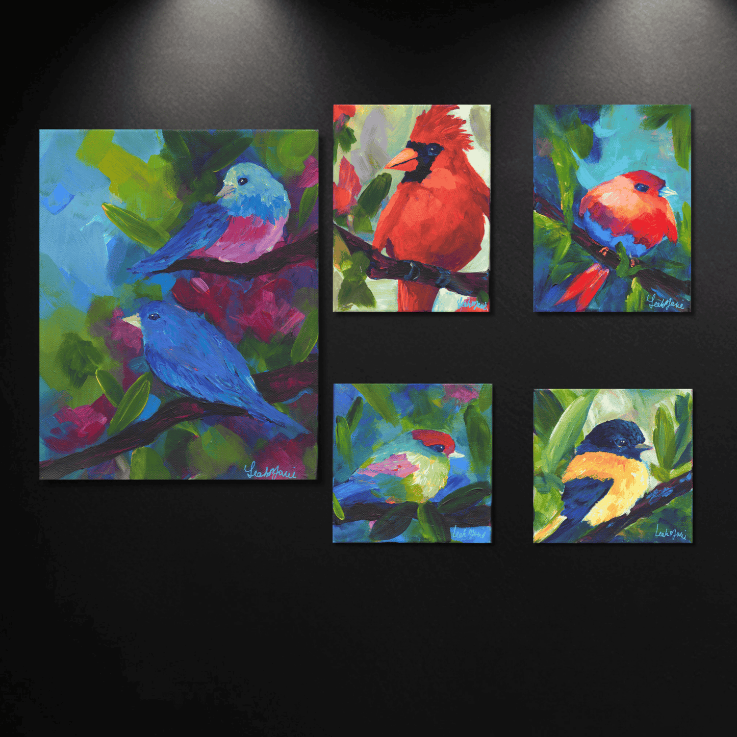 Original spring bird art collection with bold, dopamine-rich colors, featuring small canvas paintings of birds perched among bright green leaves.