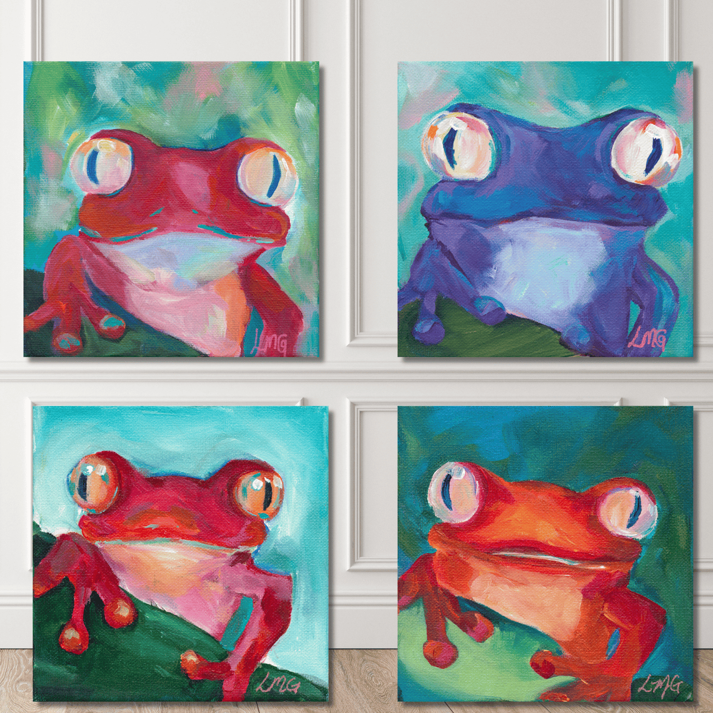 Four colorful frog paintings on a wall.