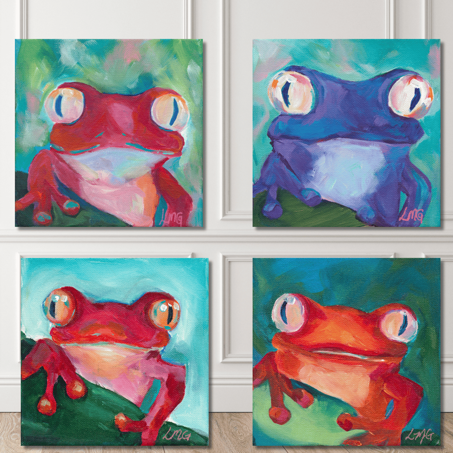 Four colorful frog paintings on a wall.
