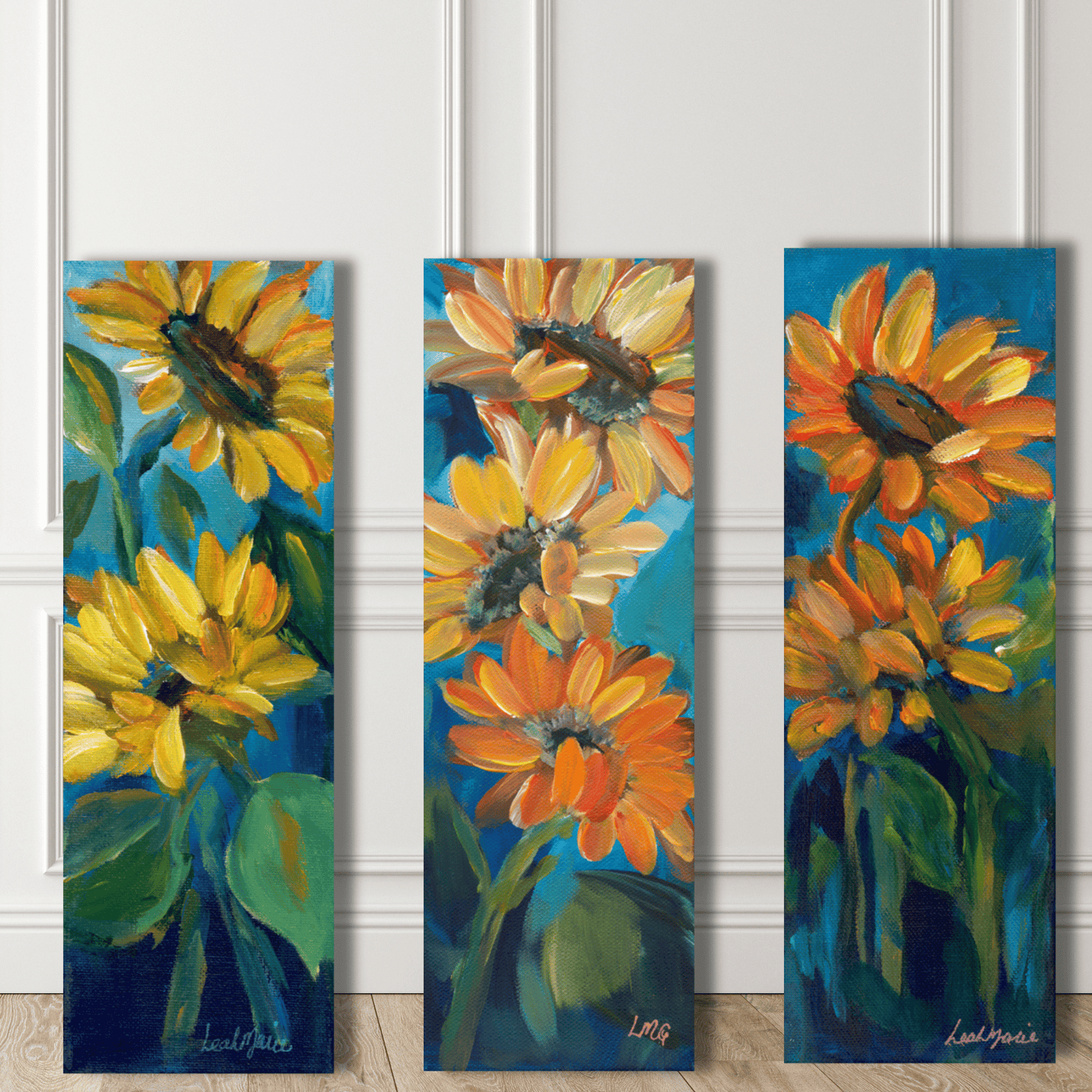 Three vertical paintings of sunflowers on a white paneled wall.