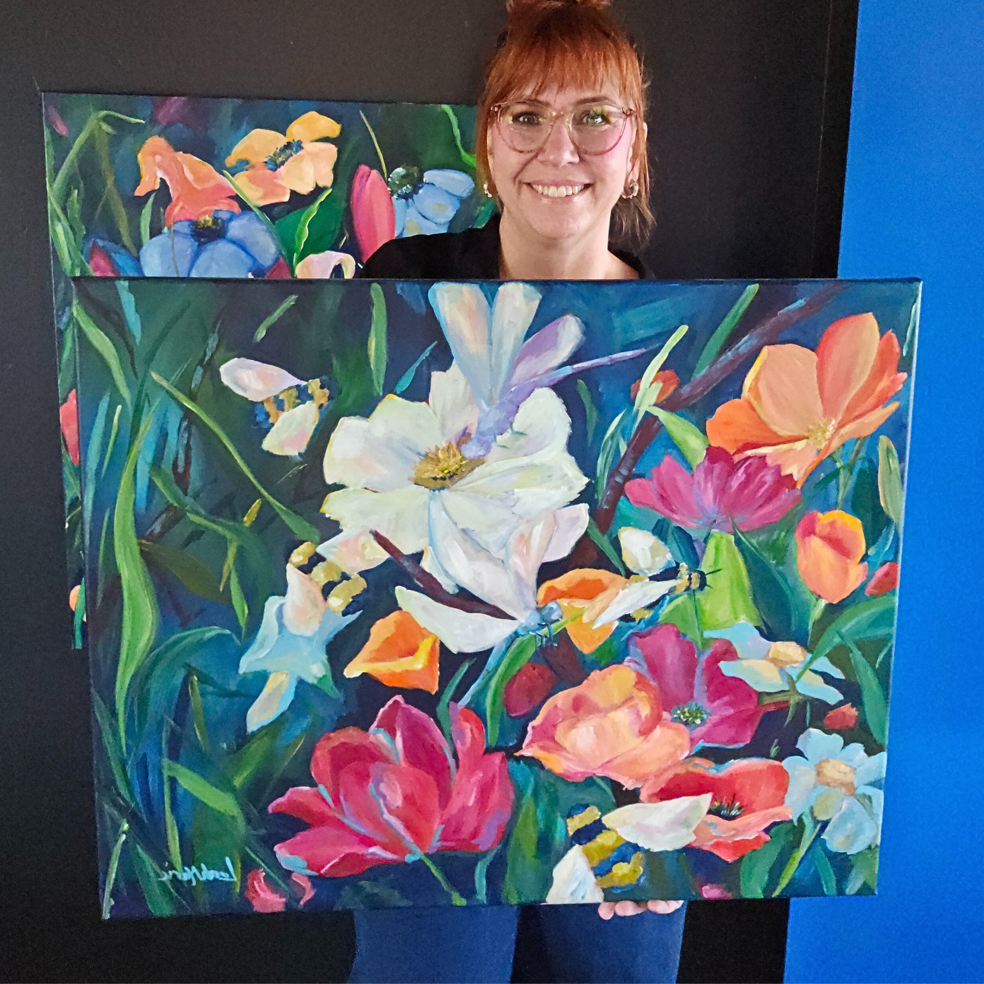 leah marie dopamine artist sharing her dopamine floral and bee colorful painting in a dopamine filled living room